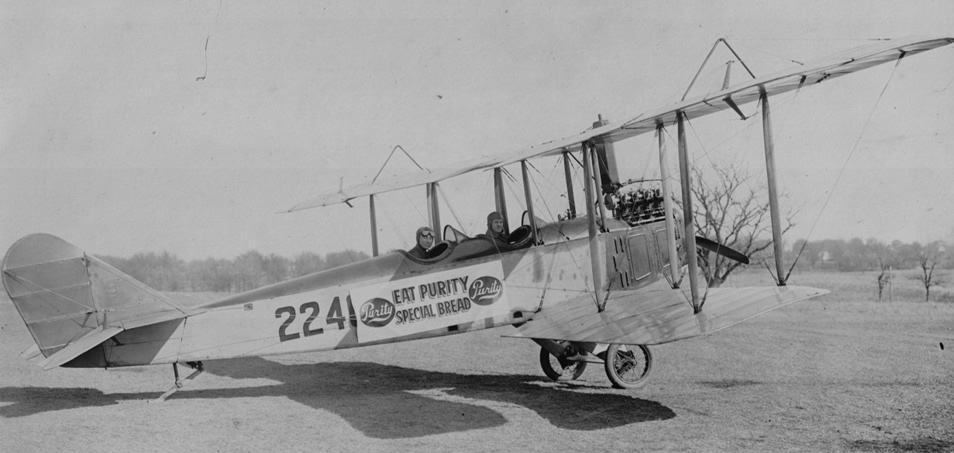 >Nick Mamer (rear) in a Curtiss JN4 Jenny (©2019 Spokane Valley Heritage Museum)