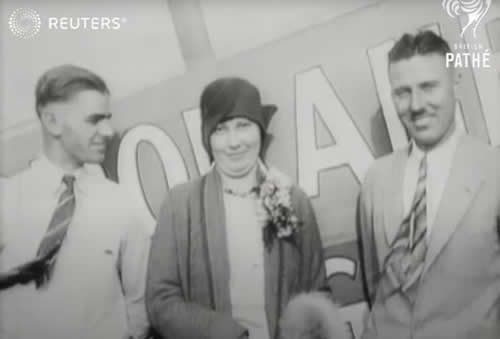 Art Walker, Faye Mamer, and Nick Mamer next to the Spokane Sun God